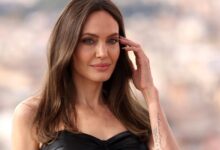 Angelina jolie looks unrecognizable with larger than life disco curls