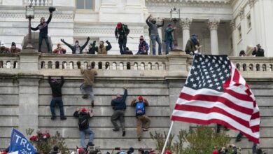 Politico demands josh hawley stop using infamous 1 6 photo on his campaign merchandise