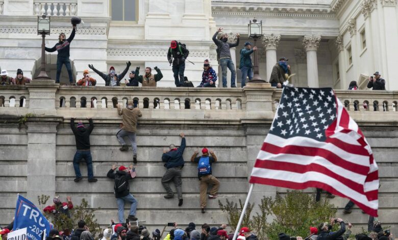 Politico demands josh hawley stop using infamous 1 6 photo on his campaign merchandise