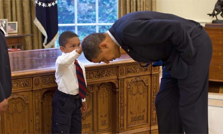 Barack obama catches up with the boy who asked to touch his hair in pete souzas iconic oval office photo