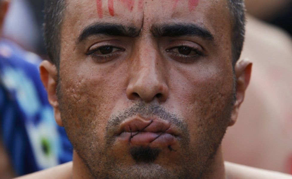 Lips sewn shut sew protest migrant border reuters iranians Migrants are sewing their lips shut to protest the policy that stranded them in mexico