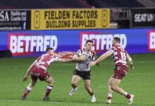 Super league wigan warriors rout salford red devils 64 0 to retain league leaders shield