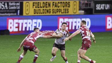 Super league wigan warriors rout salford red devils 64 0 to retain league leaders shield