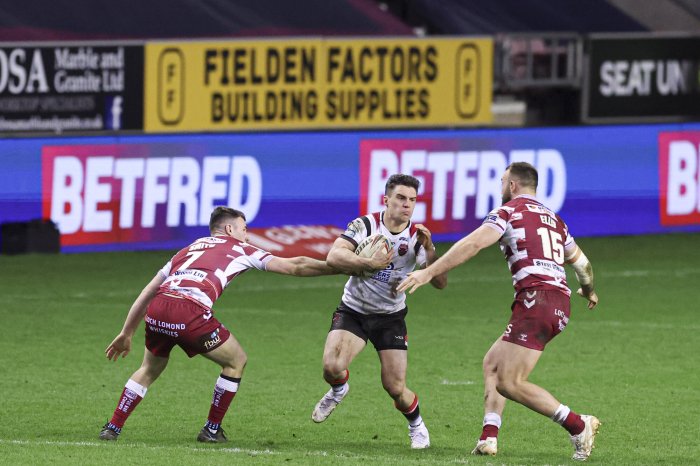 Super league wigan warriors rout salford red devils 64 0 to retain league leaders shield