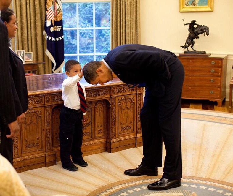 Barack obama catches up with the boy who asked to touch his hair in pete souzas iconic oval office photo