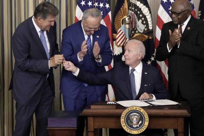 Biden signs inflation reduction act into law sealing major democratic victory on climate health care and taxes