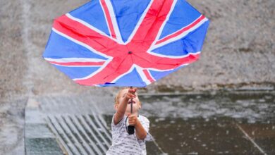 Wearing face over oxford puddle country street jump lockdown pedestrians relax masks restrictions two