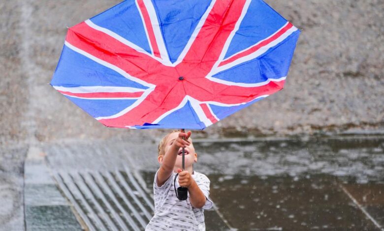 Wearing face over oxford puddle country street jump lockdown pedestrians relax masks restrictions two